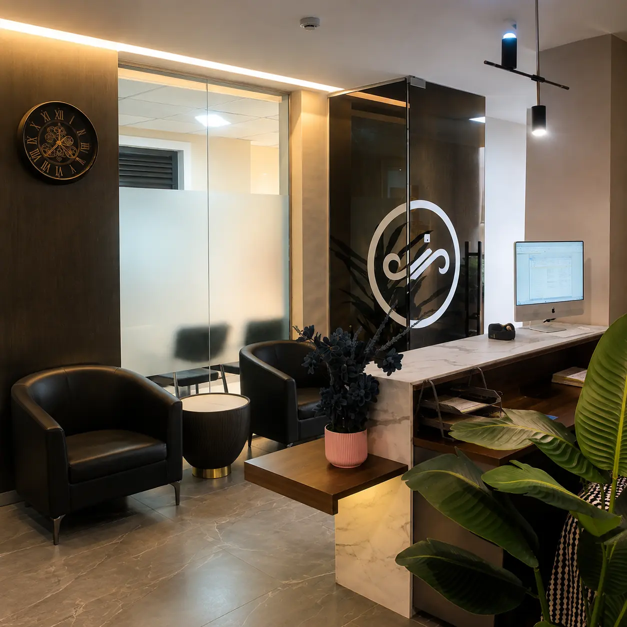 Reception lounge with the firm's monogram